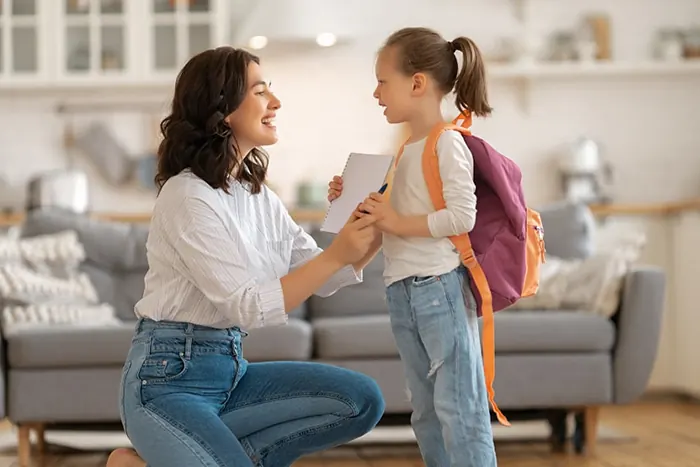 mom getting child ready for school