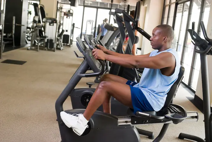 man exercising on stationary bike