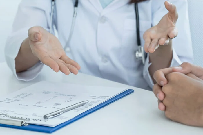 discussing weight loss treatments with doctor