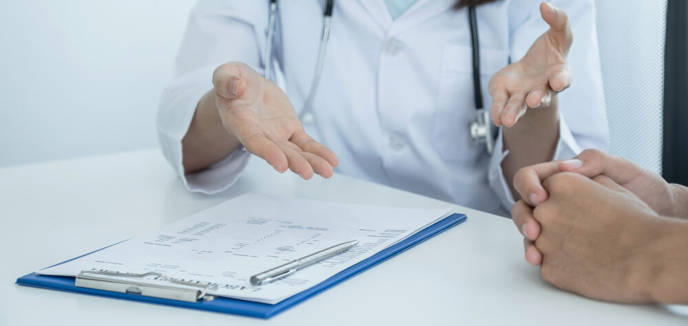 discussing weight loss treatments with doctor