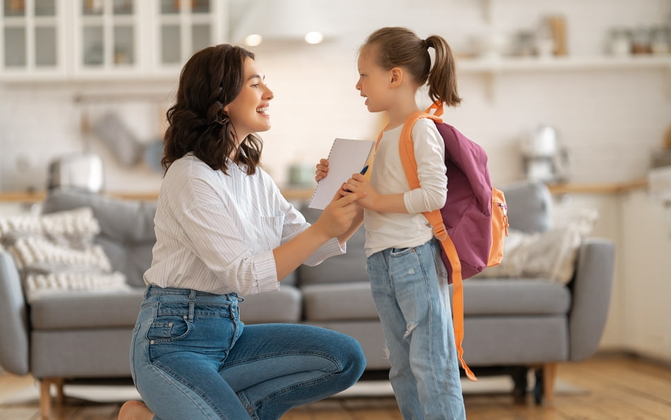 mom getting child ready for school