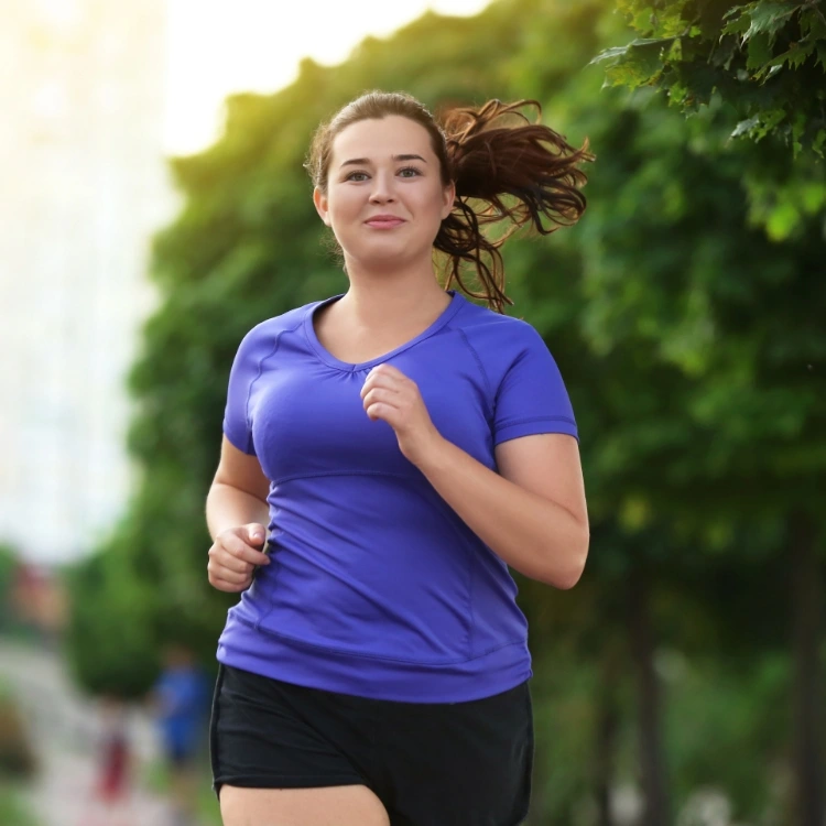 happy woman jogging and working on a healthier lifestyle