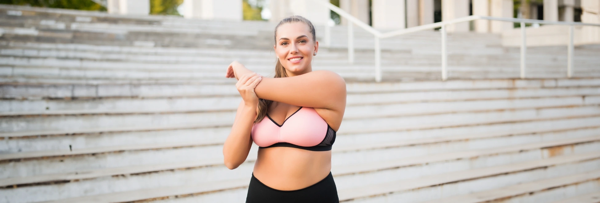 woman trying to lose weight exercising on stairs outside