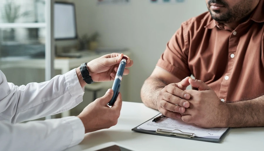 Doctor explaining weight loss medication with patient