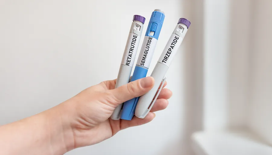 man holding weight loss injection medications